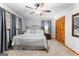 Cozy bedroom featuring a ceiling fan, neutral carpet and matching draperies at 1407 Highway 92 N, Fayetteville, GA 30214