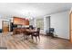 Bright dining room featuring chandelier lighting, hardwood flooring and a view to the kitchen at 1407 Highway 92 N, Fayetteville, GA 30214