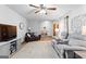 Spacious living area featuring comfortable sofas, a large TV, and a warm and inviting atmosphere at 1407 Highway 92 N, Fayetteville, GA 30214