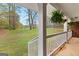 View from the porch features a large backyard with a peaceful view of nature at 1407 Highway 92 N, Fayetteville, GA 30214