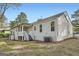 Exterior view of the back of the house showing the covered porch and the yard at 2069 Sandtown Sw Rd, Atlanta, GA 30311