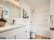 Clean bathroom features a vanity with quartz countertop, and a shower-tub combo at 2069 Sandtown Sw Rd, Atlanta, GA 30311