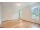 Empty bedroom showcasing natural light from two large windows and hardwood floors at 2069 Sandtown Sw Rd, Atlanta, GA 30311
