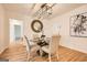 Elegant dining area with a modern chandelier and hardwood floors at 2069 Sandtown Sw Rd, Atlanta, GA 30311