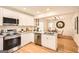 Updated kitchen featuring stainless steel appliances, granite countertops, and hardwood floors at 2069 Sandtown Sw Rd, Atlanta, GA 30311