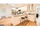 Bright kitchen with a breakfast bar, stainless steel appliances, and granite countertops at 2069 Sandtown Sw Rd, Atlanta, GA 30311