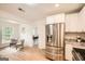 Modern kitchen with stainless steel appliances, white cabinetry, and hardwood floors at 2069 Sandtown Sw Rd, Atlanta, GA 30311