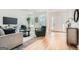 Bright living room featuring hardwood floors, ample natural light, and stylish furnishings at 2069 Sandtown Sw Rd, Atlanta, GA 30311