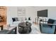 Open-concept living room featuring modern decor, hardwood floors, and abundant light at 2069 Sandtown Sw Rd, Atlanta, GA 30311