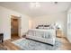 Spacious bedroom featuring a walk-in closet, a large bed, and natural light at 2069 Sandtown Sw Rd, Atlanta, GA 30311