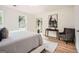 Bright bedroom with a horse art piece, neutral colors, and natural light from two windows at 2069 Sandtown Sw Rd, Atlanta, GA 30311