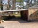 Carport area with ample space, featuring stone and brick accents at 3249 E Stratton Ln, Scottdale, GA 30079