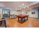 Finished basement featuring a pool table, seating, and a partial view of the bar area at 1744 Elks Club Rd, Covington, GA 30014