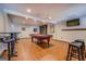 Basement entertainment area with pool table, bar stools, and ample room for guests at 1744 Elks Club Rd, Covington, GA 30014