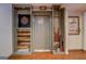 Basement storage area featuring a dart board, pool cues, and stylish wood accents at 1744 Elks Club Rd, Covington, GA 30014