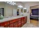 Spacious bathroom boasts a double vanity with abundant drawers and a view into the bedroom at 1744 Elks Club Rd, Covington, GA 30014