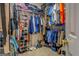 Well-organized walk-in closet with shelves, rods, and sections for shoes, bags, and clothes at 1744 Elks Club Rd, Covington, GA 30014