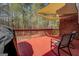 Relax on the red wooden deck with a shade awning overlooking serene wooded views at 1744 Elks Club Rd, Covington, GA 30014