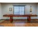 Finished game room featuring a full size shuffleboard table and hardwood floors at 1744 Elks Club Rd, Covington, GA 30014