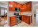 Kitchen features well-maintained cabinets, modern appliances, and views to other rooms in the home at 1744 Elks Club Rd, Covington, GA 30014