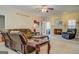 Spacious living room features plush furniture, glass-topped coffee tables, fireplace and access to the outdoors at 1744 Elks Club Rd, Covington, GA 30014