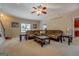 Bright living room with plush sofas, neutral carpet, and large windows allowing natural light at 1744 Elks Club Rd, Covington, GA 30014