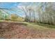 Expansive backyard with lush greenery, offering ample space for outdoor activities at 319 Honeysuckle Ter, Auburn, GA 30011