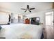 Spacious bedroom with a ceiling fan, built-in shelves, and stylish wood-look flooring at 319 Honeysuckle Ter, Auburn, GA 30011