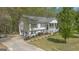 Picturesque home with a two-car garage, well-maintained lawn, and welcoming front porch at 319 Honeysuckle Ter, Auburn, GA 30011