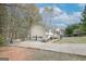 Inviting home with a two-car garage, paved driveway, and welcoming front porch at 319 Honeysuckle Ter, Auburn, GA 30011