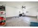 Spacious garage with ceiling fan and windows, perfect for workshop or storage at 319 Honeysuckle Ter, Auburn, GA 30011