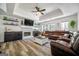 Bright living room with a stone fireplace, modern furniture, and stylish decor; hardwood floors at 319 Honeysuckle Ter, Auburn, GA 30011