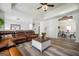 Spacious living room boasts with a large sofa, coffee table, and hardwood floors at 319 Honeysuckle Ter, Auburn, GA 30011