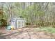 Backyard shed with plenty of storage and a serene wooded backdrop at 319 Honeysuckle Ter, Auburn, GA 30011