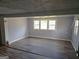 Bedroom with hardwood flooring, neutral walls, and bright natural light at 3314 Henson Ln, Stockbridge, GA 30281