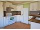 Kitchen featuring white cabinets, butcher block countertops, and hardwood floors at 3314 Henson Ln, Stockbridge, GA 30281