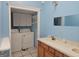 Functional laundry room with cabinetry, a sink, a mirror, shelving, and washer/dryer hookups for added convenience and organization at 3314 Henson Ln, Stockbridge, GA 30281