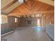 This spacious living room features exposed wood beams, a brick fireplace, and ample natural light, creating a warm and inviting atmosphere at 3314 Henson Ln, Stockbridge, GA 30281