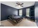 Bedroom boasts neutral walls, carpet, and a large window for natural light at 205 Wynnfield Way, Mcdonough, GA 30252