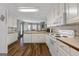 Well-lit kitchen with ample counter space, modern appliances, and hardwood floors, perfect for culinary enthusiasts at 205 Wynnfield Way, Mcdonough, GA 30252