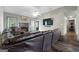 Cozy living room features a fireplace, hardwood floors, and comfortable seating, creating a relaxing atmosphere at 205 Wynnfield Way, Mcdonough, GA 30252