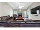 Inviting living room with a fireplace, ceiling fan, and hardwood floors, ideal for relaxation and entertainment at 205 Wynnfield Way, Mcdonough, GA 30252