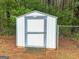 Backyard shed featuring blue and white trim, providing convenient outdoor storage space at 205 Wynnfield Way, Mcdonough, GA 30252