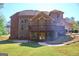 Expansive backyard features a deck, patio, and lush lawn for outdoor enjoyment at 65 Lotus Ln, Covington, GA 30016