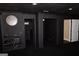Finished basement space with dark walls, providing a versatile area for entertainment or relaxation at 65 Lotus Ln, Covington, GA 30016