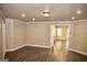 Large finished basement showcasing wood flooring and ample lighting, perfect for a recreation area at 65 Lotus Ln, Covington, GA 30016