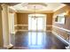 Dining room featuring a chandelier, wainscoting, and columns at 65 Lotus Ln, Covington, GA 30016