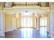 Grand foyer with high ceilings, columns, and decorative tile flooring at 65 Lotus Ln, Covington, GA 30016