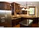Gourmet kitchen features granite countertops, stainless steel appliances, and custom cabinetry at 65 Lotus Ln, Covington, GA 30016