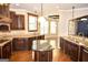 Modern kitchen with granite countertops, stainless steel appliances, and open layout to the living area at 65 Lotus Ln, Covington, GA 30016